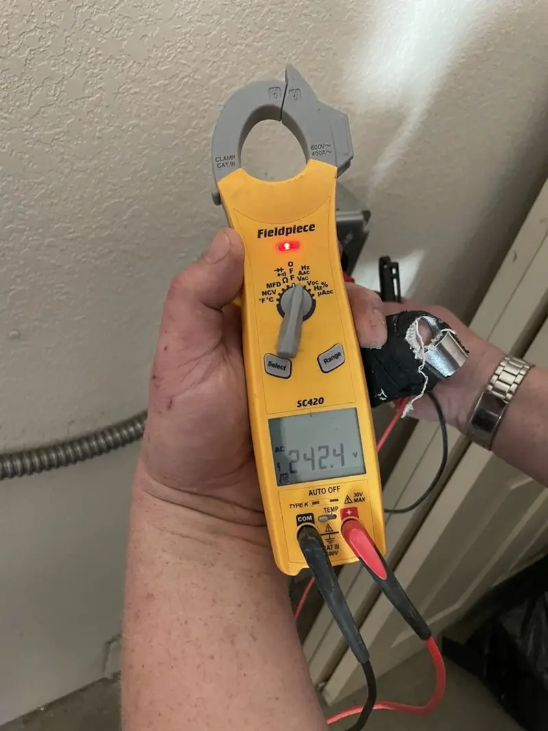 Voltage testing with clamp meter during Recessed Lighting Installation in Auburn